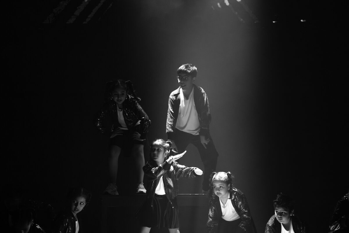 Hip-Hop students performing on stage at Dance Central Dubai